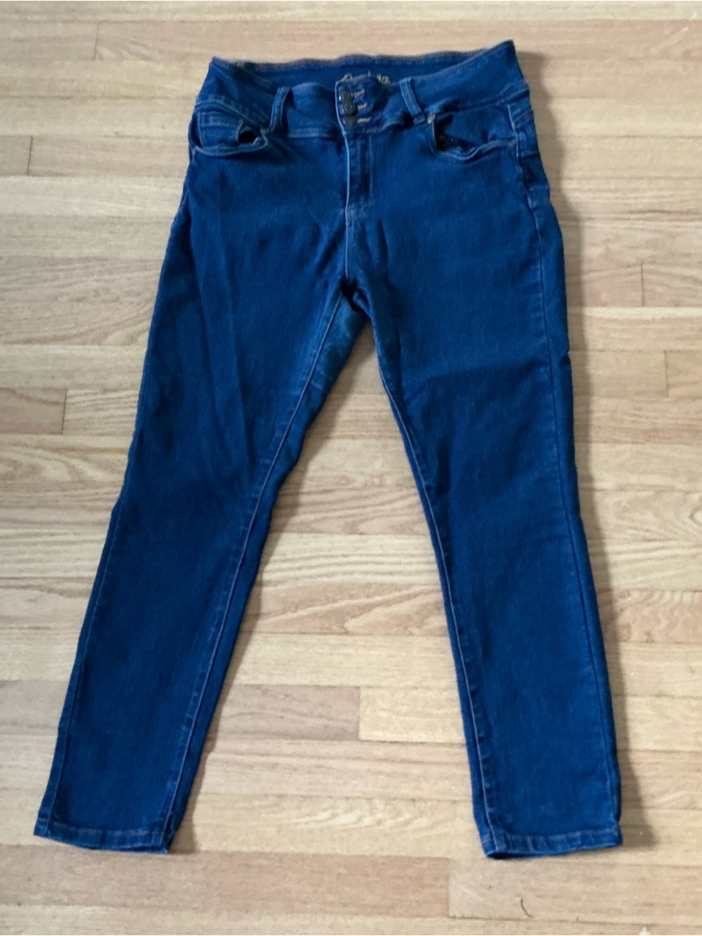 Medium wash blue denim skinny jeans, high waisted